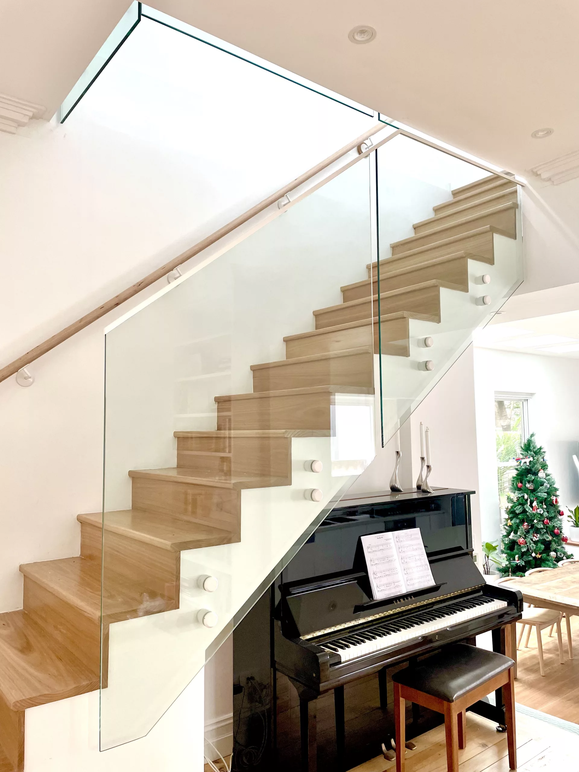 Stair glass balustrade with powder coated top rail and fittings