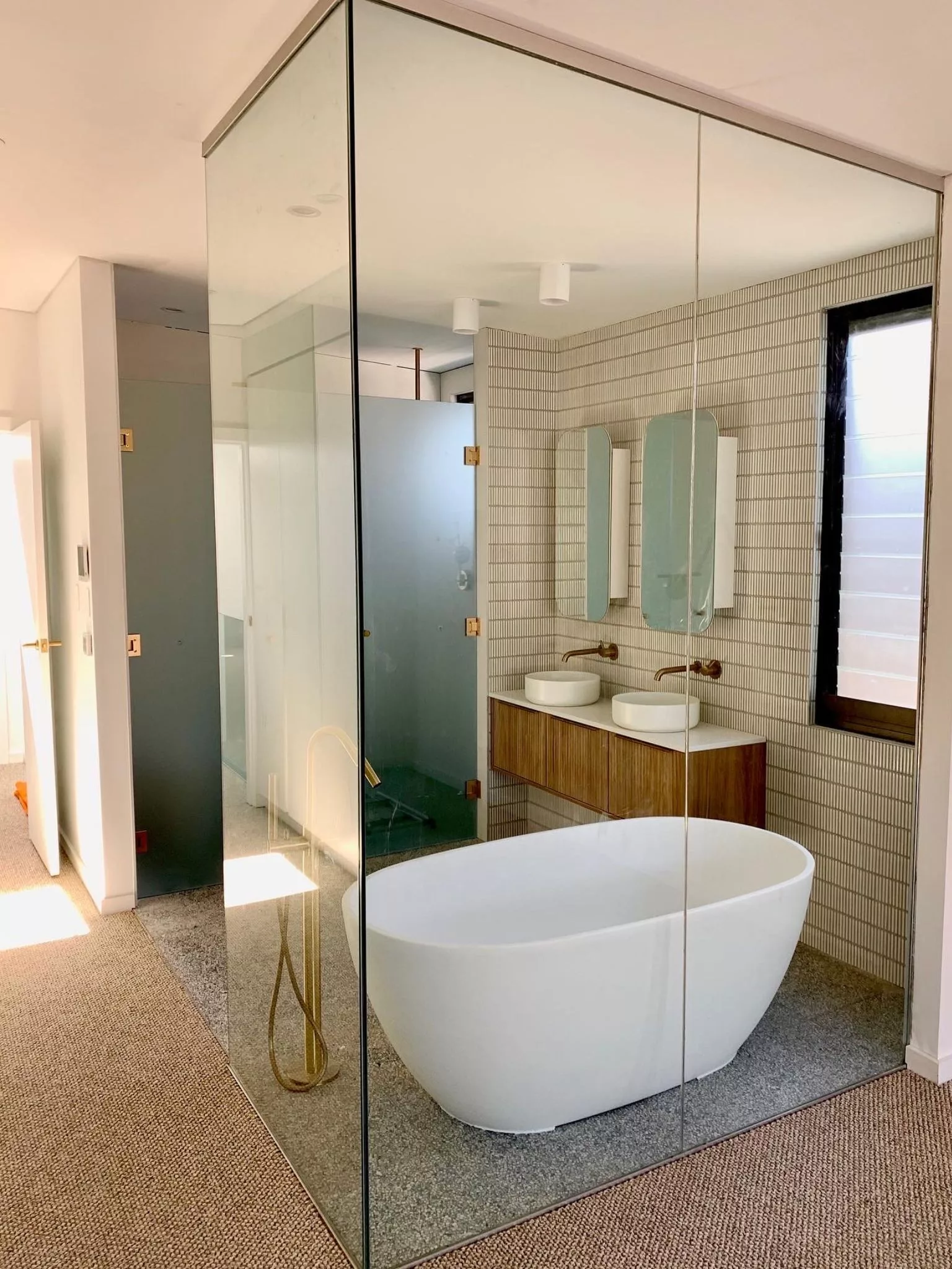 Floor to ceiling frameless glass enclosure